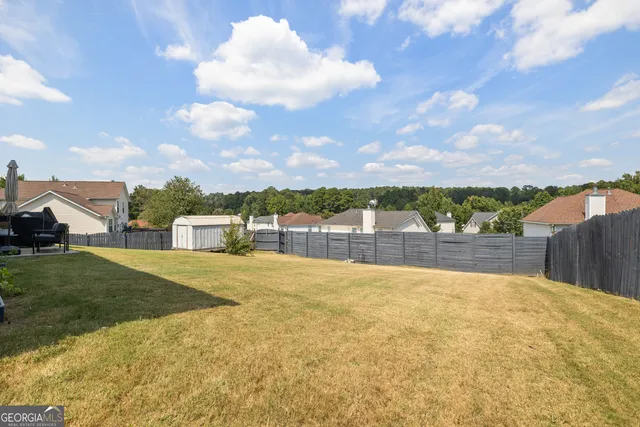 a view of swimming pool with a yard