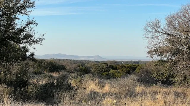a view of mountain with lake view