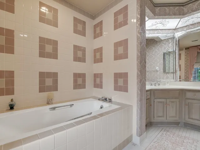 a bathroom with a bathtub and shower