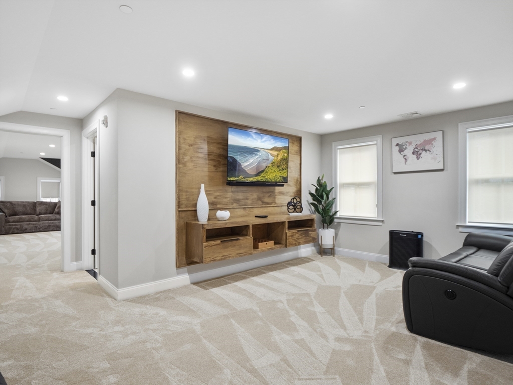 140 Middlesex Street, Unit 3 Lowell, MA 01852 - Photo 22 of 30 a living room with furniture and a flat screen tv