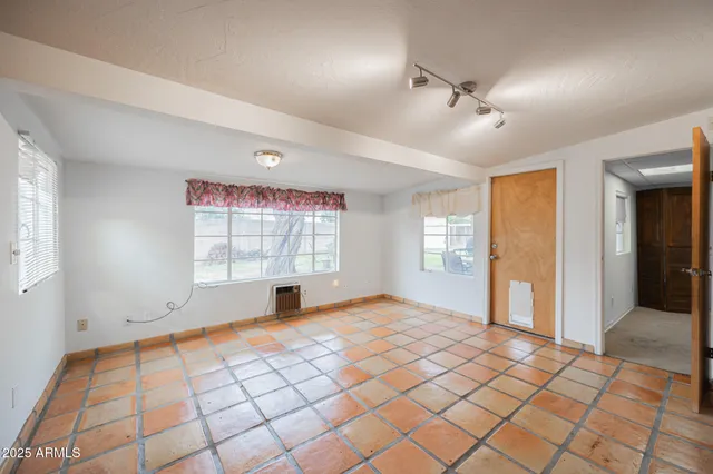 a view of an empty room and window