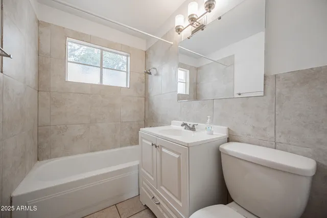 a view of a house with a snow in the yard