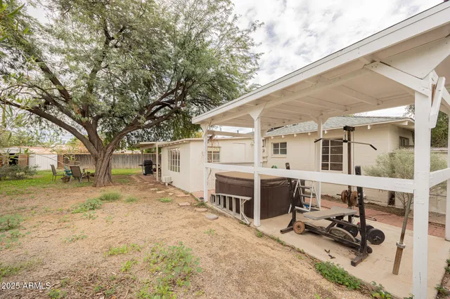 a backyard of house with seating space