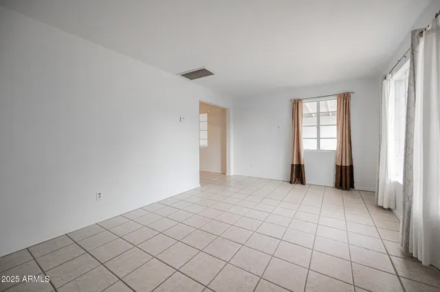 a view of an empty room and window