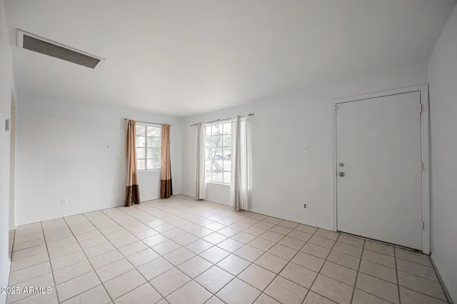 a view of an empty room and window