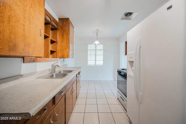 a bathroom with a sink a mirror and a shower