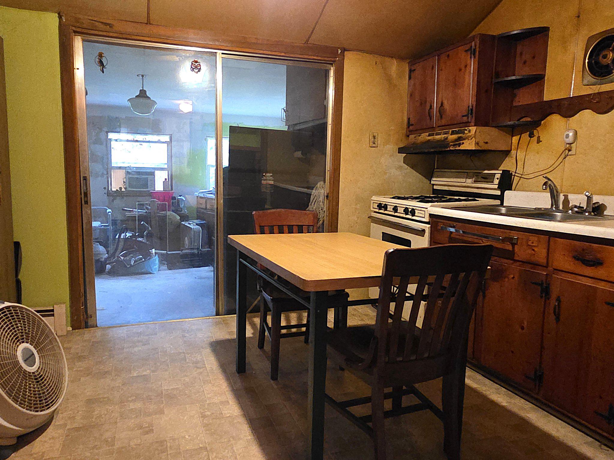 1128 Pearsons Corner Road Hartly, DE 19953 - Photo 34 of 63 kitchen with sliders to enclosed porch