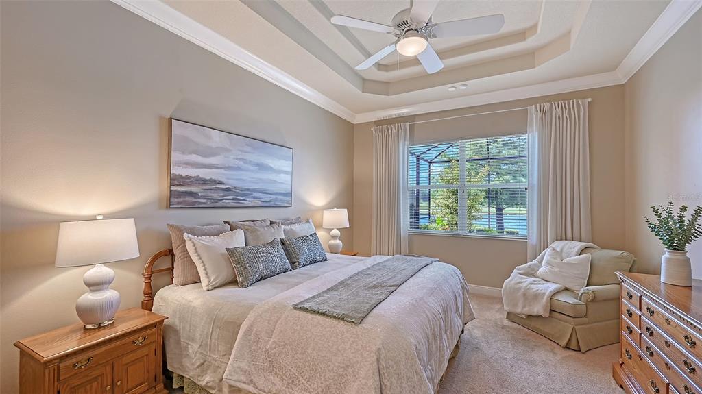 14718 Secret Harbor Place Lakewood Ranch, FL 34202 - Photo 26 of 73 a bedroom with a bed and window