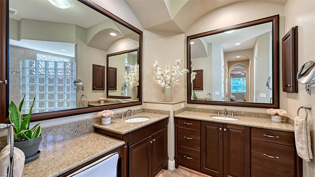14718 Secret Harbor Place Lakewood Ranch, FL 34202 - Photo 29 of 73 a bathroom with a granite countertop sink and a mirror