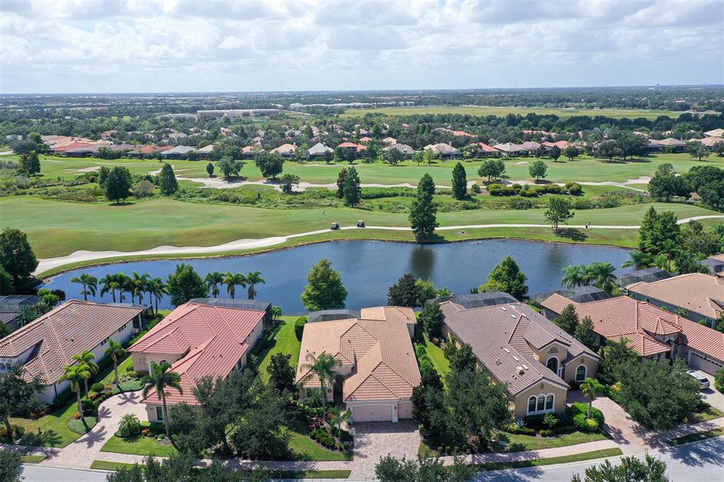 14718 Secret Harbor Place Lakewood Ranch, FL 34202 - Photo 3 of 73 an aerial view of a city with lots of residential buildings