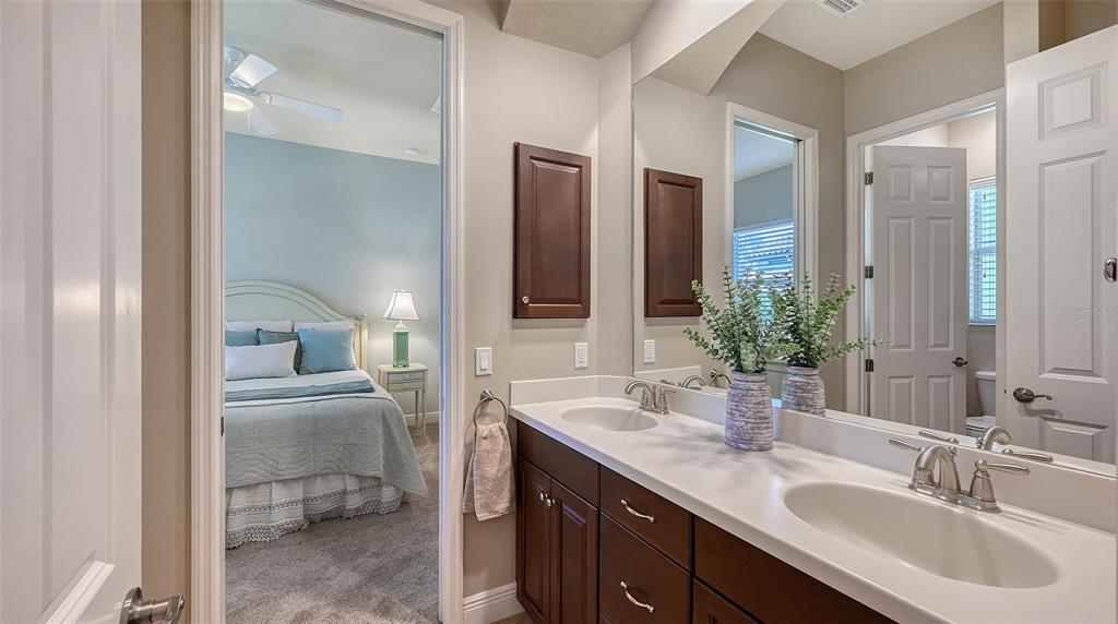 14718 Secret Harbor Place Lakewood Ranch, FL 34202 - Photo 32 of 73 a bathroom with a sink and a mirror