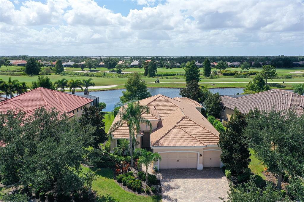 14718 Secret Harbor Place Lakewood Ranch, FL 34202 - Photo 4 of 73 an aerial view of a house with outdoor space and street view