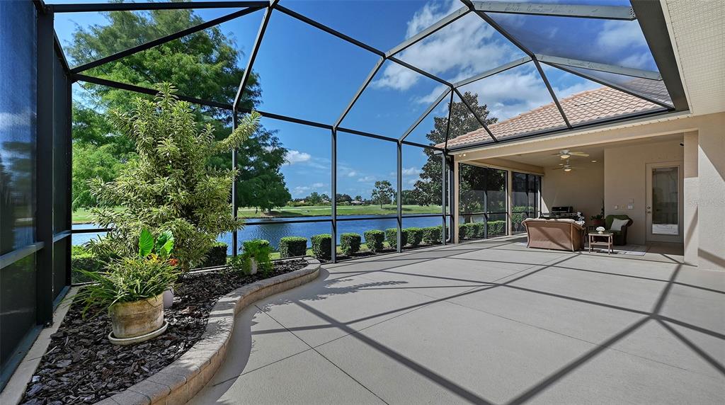 14718 Secret Harbor Place Lakewood Ranch, FL 34202 - Photo 46 of 73 a building outdoor space with patio furniture and potted plants