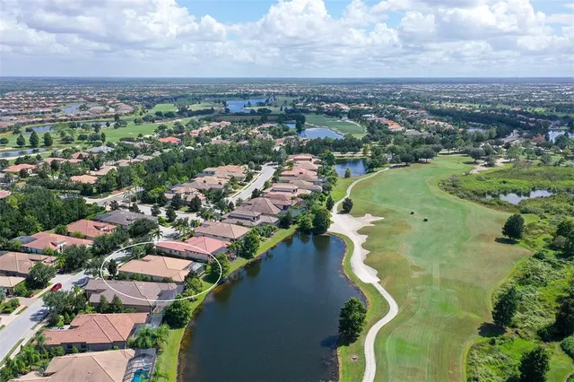 an aerial view of a residential houses with outdoor space