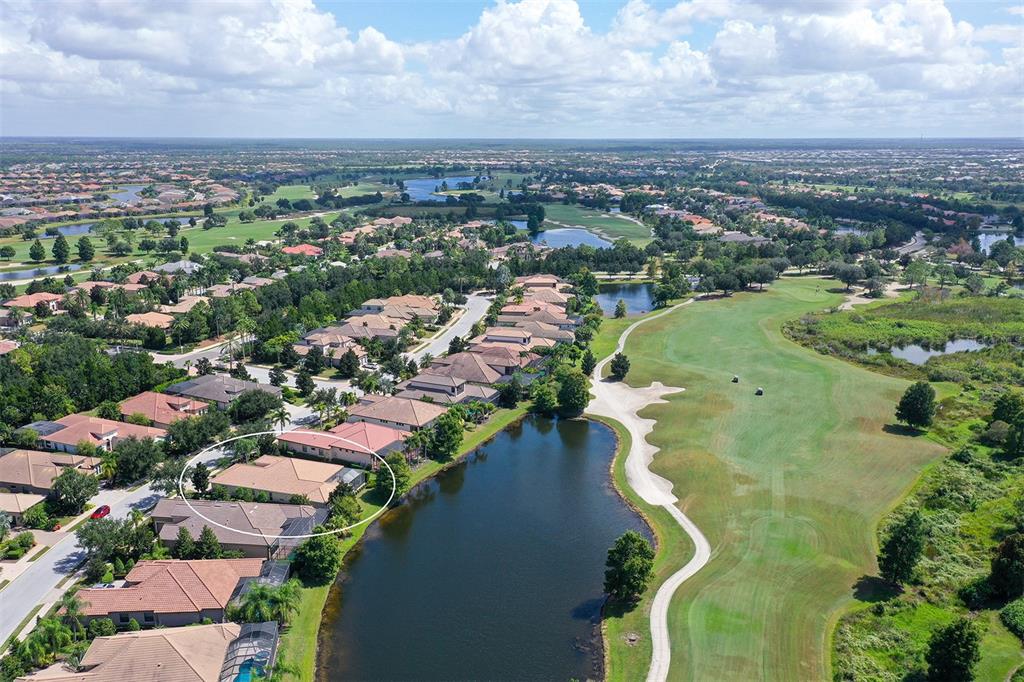 14718 Secret Harbor Place Lakewood Ranch, FL 34202 - Photo 50 of 73 an aerial view of a city with lots of residential buildings