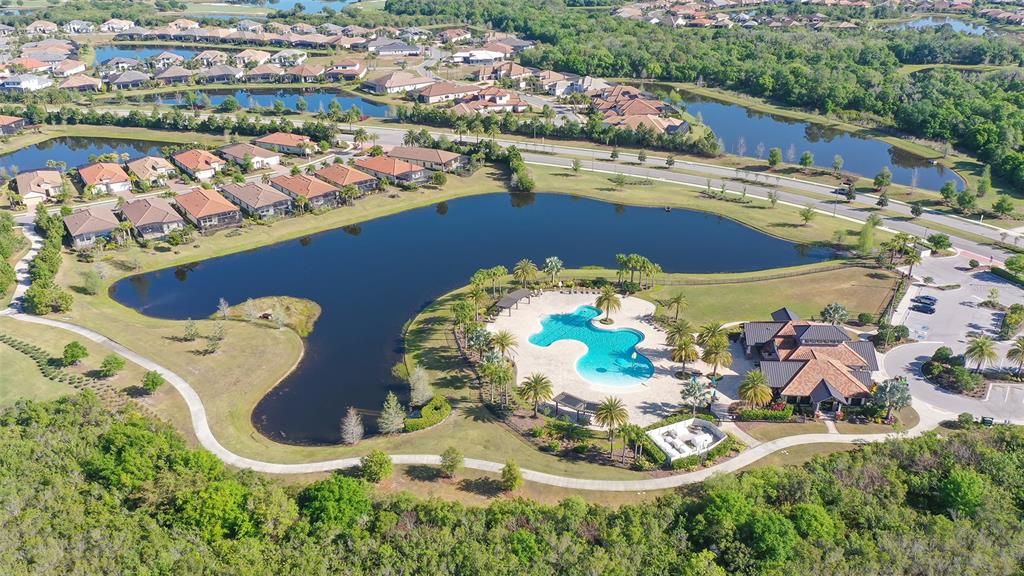 14718 Secret Harbor Place Lakewood Ranch, FL 34202 - Photo 60 of 73 an aerial view of a house with yard swimming pool and outdoor seating