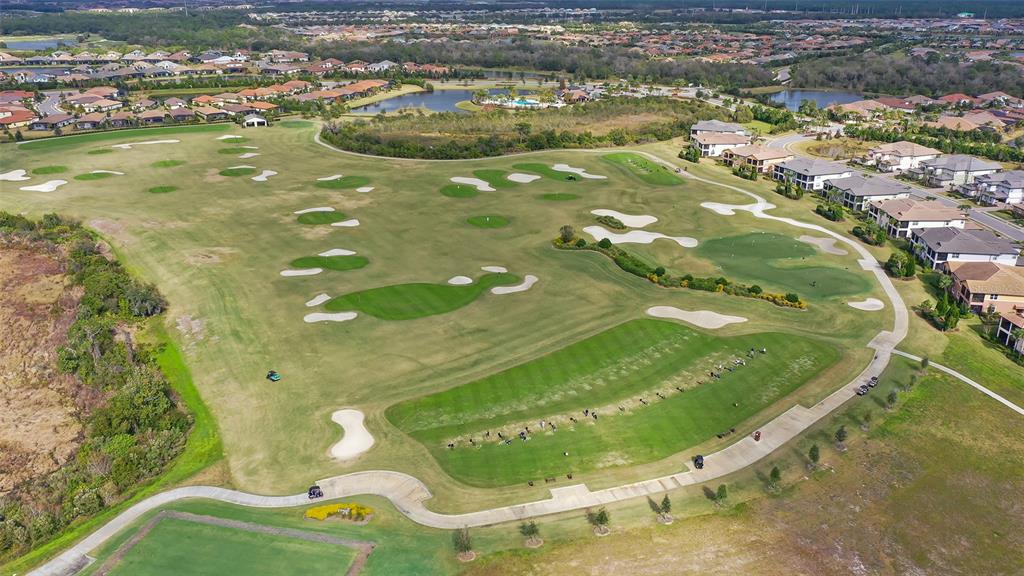14718 Secret Harbor Place Lakewood Ranch, FL 34202 - Photo 70 of 73 an aerial view of a residential houses with outdoor space