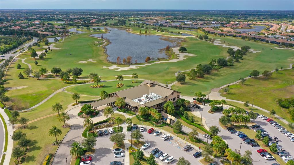 14718 Secret Harbor Place Lakewood Ranch, FL 34202 - Photo 73 of 73 an aerial view of a residential houses with outdoor space