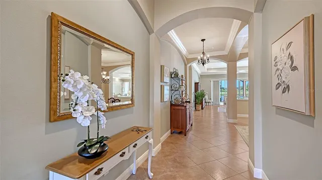 a view of a dining room with furniture wooden floor and chandelier