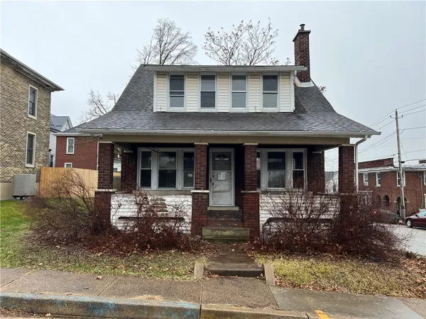 a front view of a house with yard
