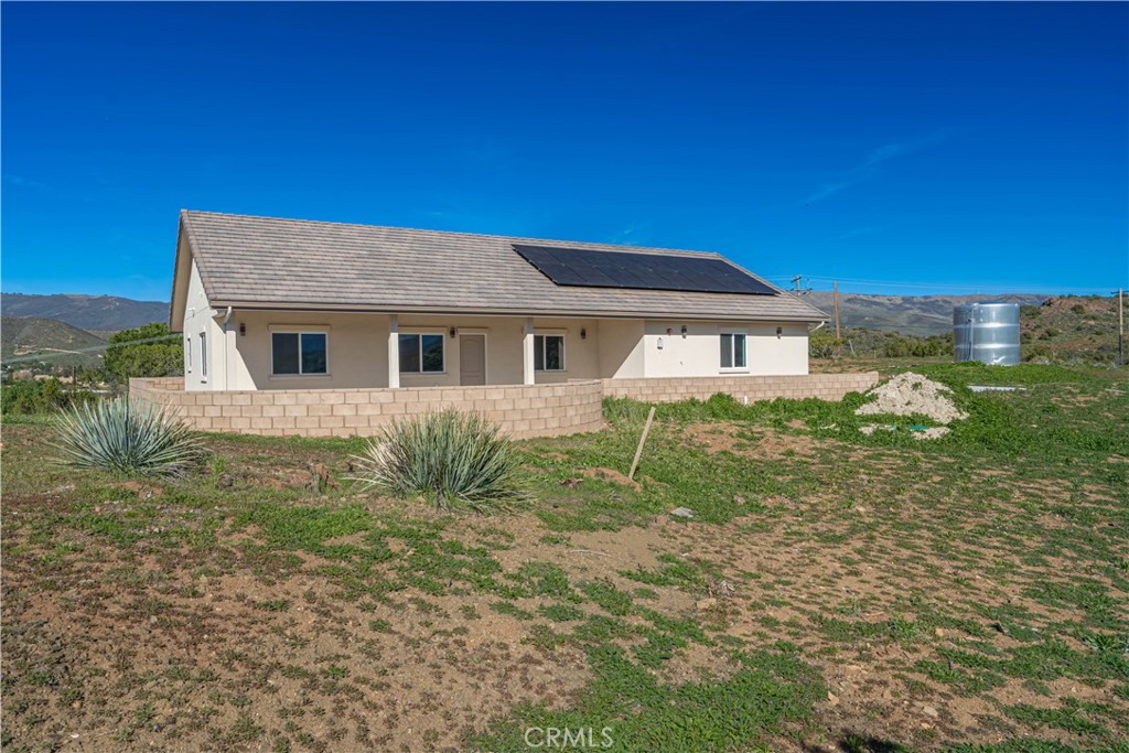 10540 Darling Road Agua Dulce, CA 91390 - Photo 47 of 56 a front view of a house with garden