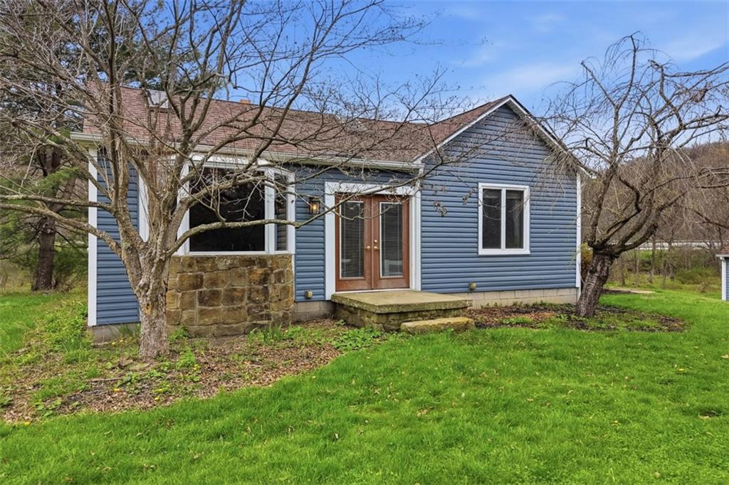 front view of a house with a yard