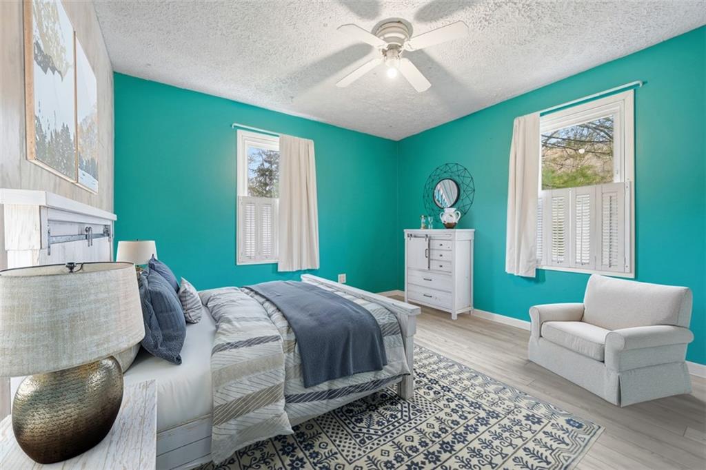192 Yellow Creek Road Harmony, PA 16037 - Photo 20 of 41 a bedroom with a bed couch and window