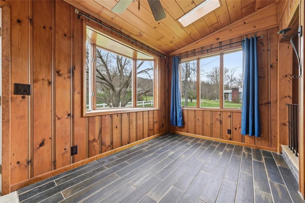 192 Yellow Creek Road Harmony, PA 16037 - Photo 4 of 41 a view of a room with wooden floor and windows