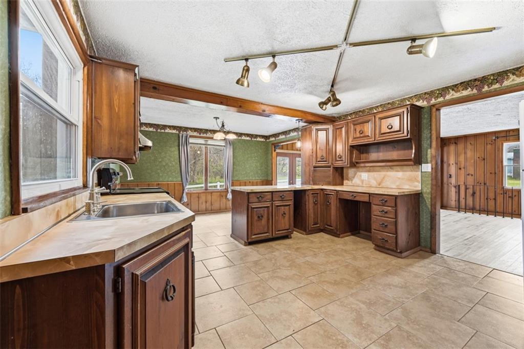 192 Yellow Creek Road Harmony, PA 16037 - Photo 10 of 41 a kitchen with stainless steel appliances granite countertop a sink and a stove
