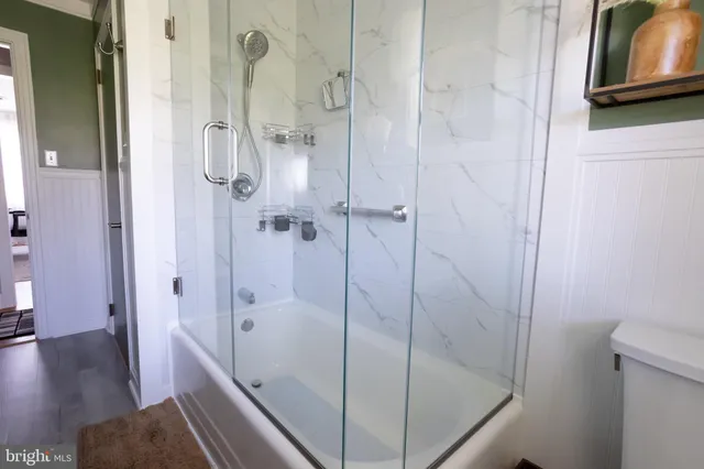 a bathroom with a bathtub and a shower