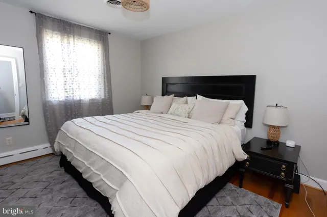 a bedroom with bed and a window