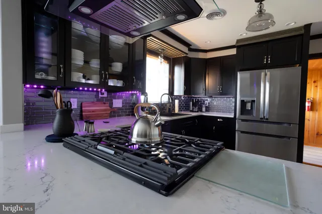 a kitchen with a stove and a refrigerator