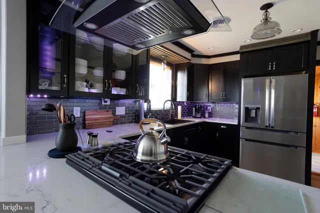 a kitchen with table and chairs
