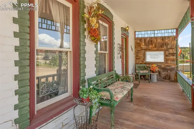 a living room filled with furniture and a large window