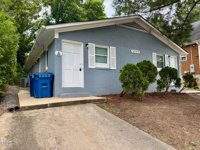 a house with trees in the background