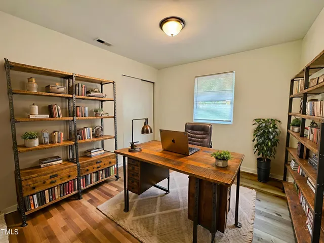a view of a workspace with furniture