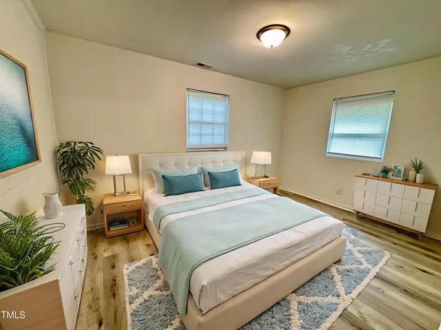 a bedroom with a bed and a couch