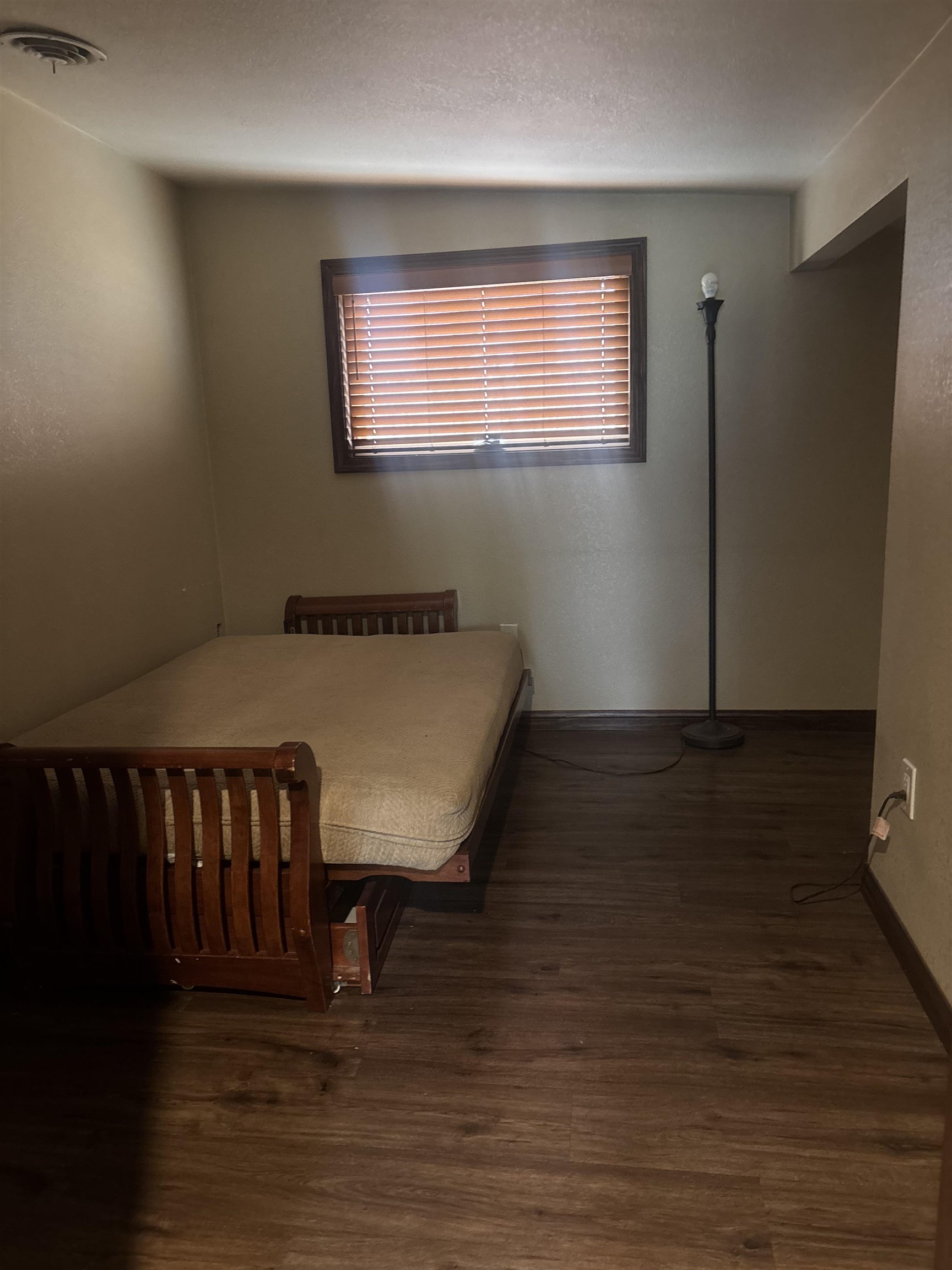 129 Sunny Slopes Road Mammoth Lakes, CA 93546 - Photo 12 of 16 Bedroom with dark wood-style flooring and a textured wall