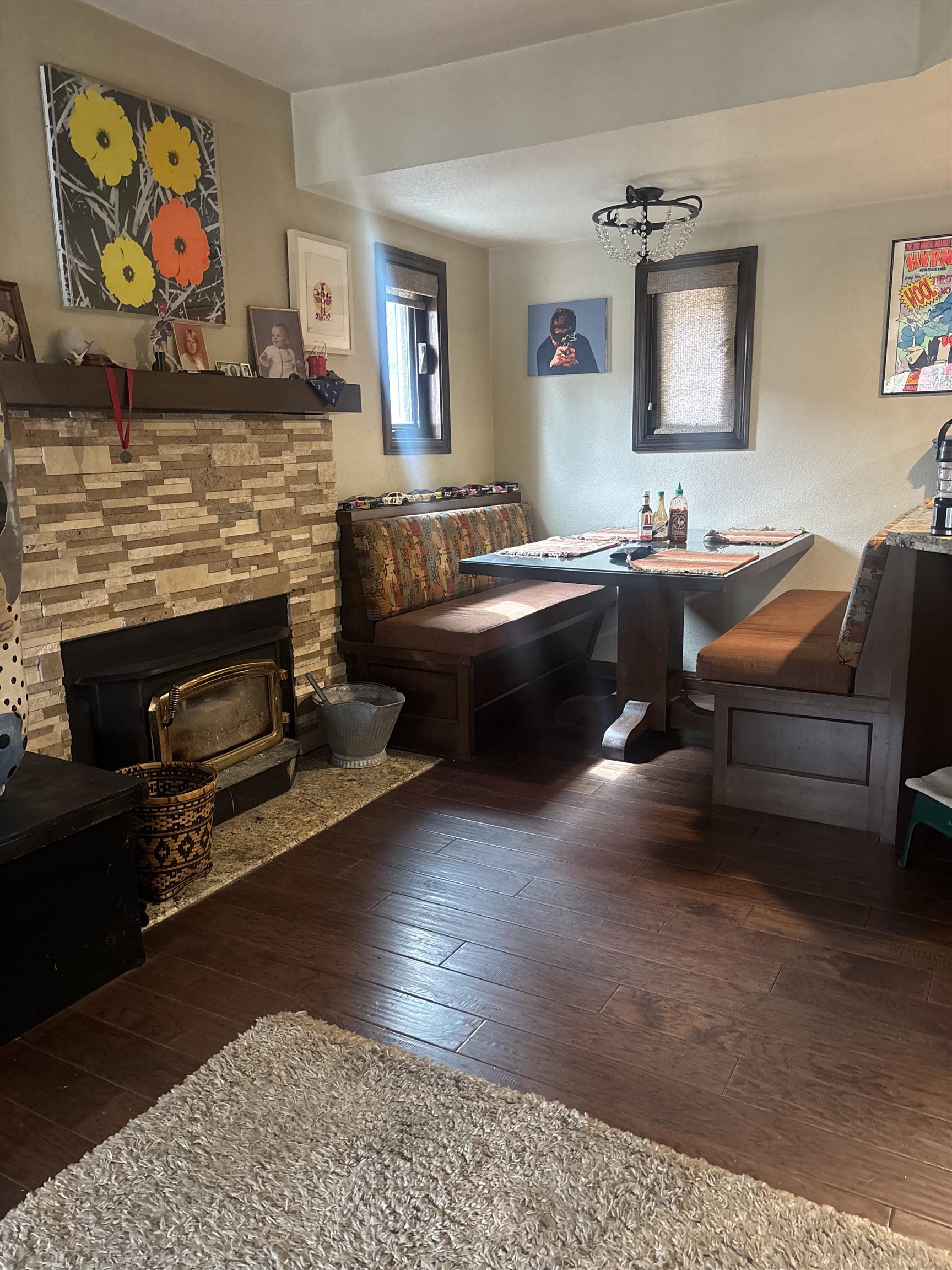 129 Sunny Slopes Road Mammoth Lakes, CA 93546 - Photo 5 of 16 Living area featuring dark wood-style floors and a stone fireplace
