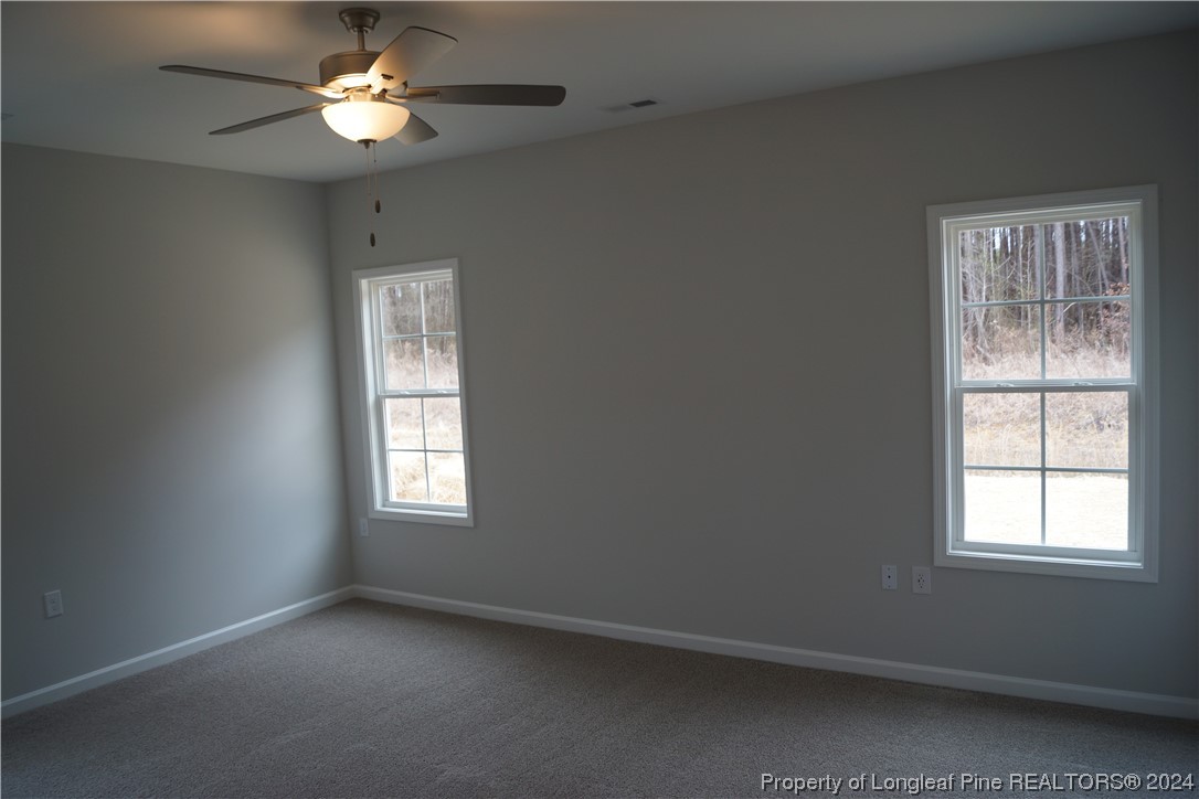 88 Knotts Berry Road Bunnlevel, NC 28323 - Photo 18 of 33 a view of an empty room with a window