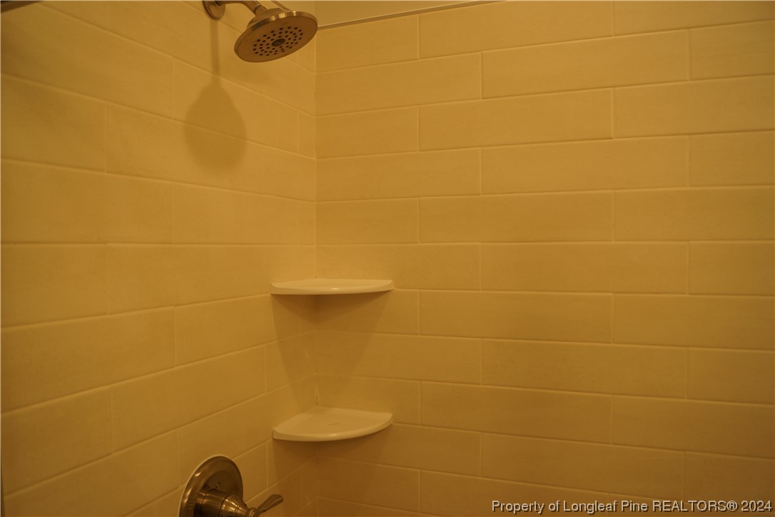 88 Knotts Berry Road Bunnlevel, NC 28323 - Photo 22 of 33 a bathroom with a shower