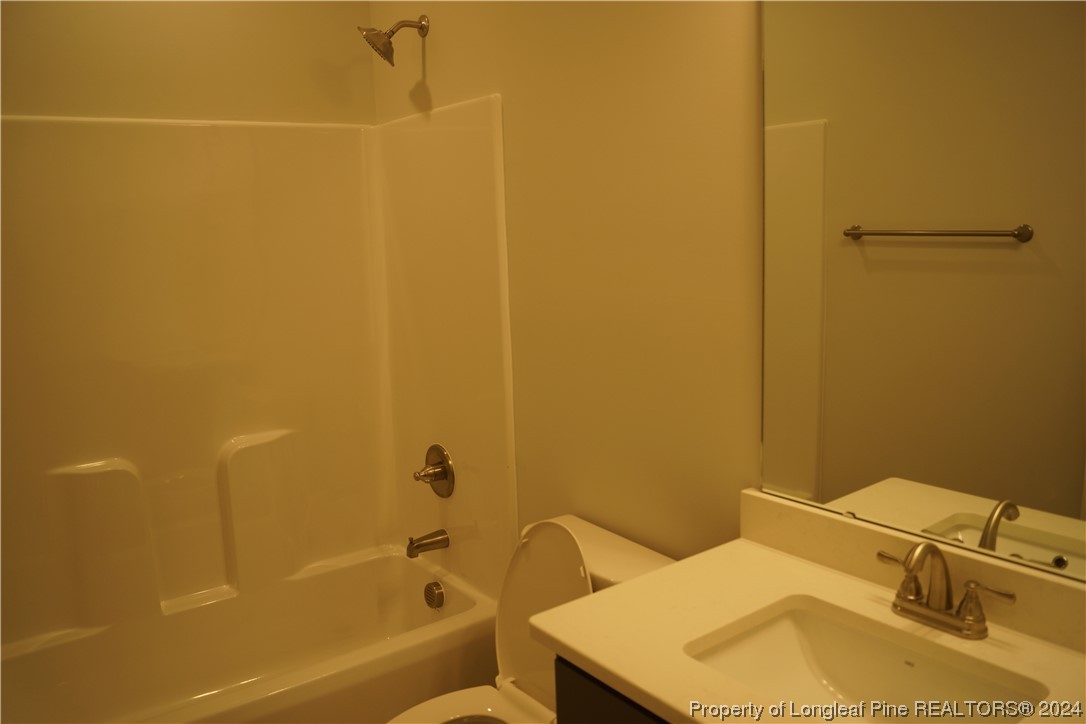 88 Knotts Berry Road Bunnlevel, NC 28323 - Photo 26 of 33 a bathroom with a sink toilet and shower