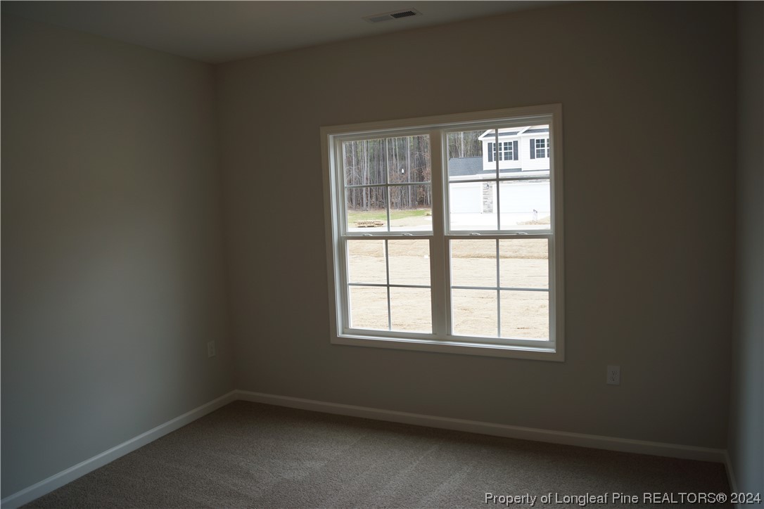 88 Knotts Berry Road Bunnlevel, NC 28323 - Photo 27 of 33 an empty room with a window