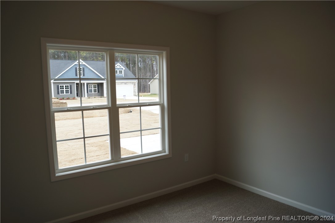 88 Knotts Berry Road Bunnlevel, NC 28323 - Photo 28 of 33 an empty room with a window