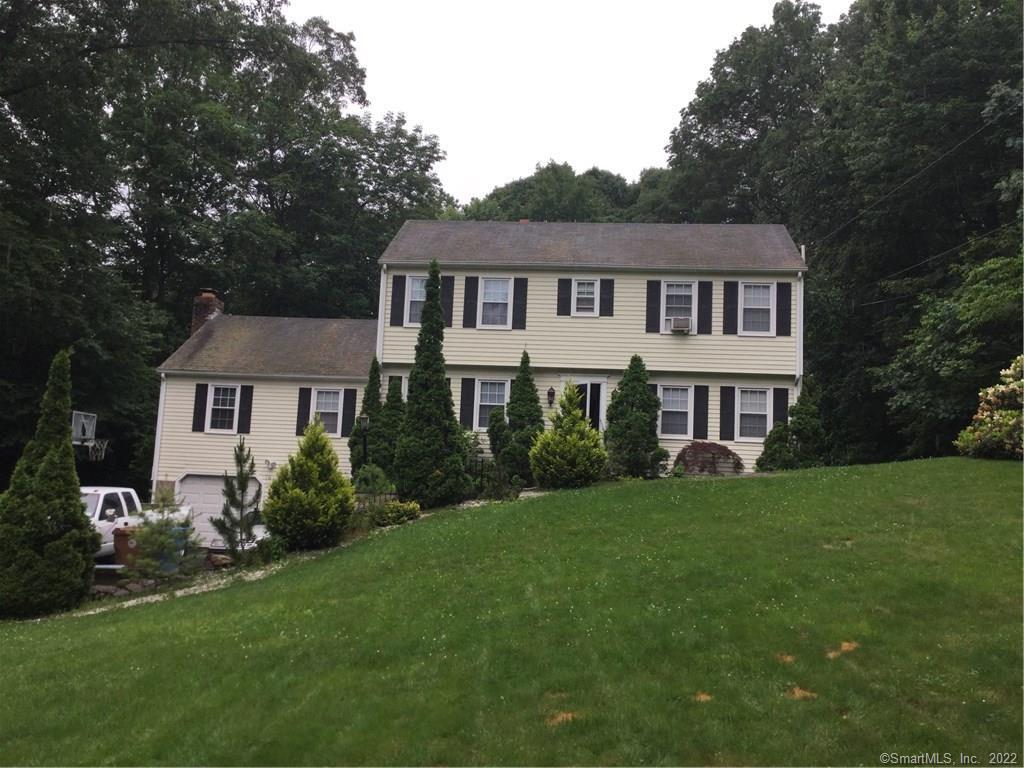 76 Autumn Ridge Road Shelton, CT 06484 - Photo 1 of 1 a front view of a house with a garden