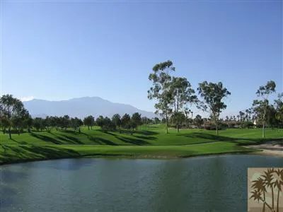 a view of a golf course with a lake