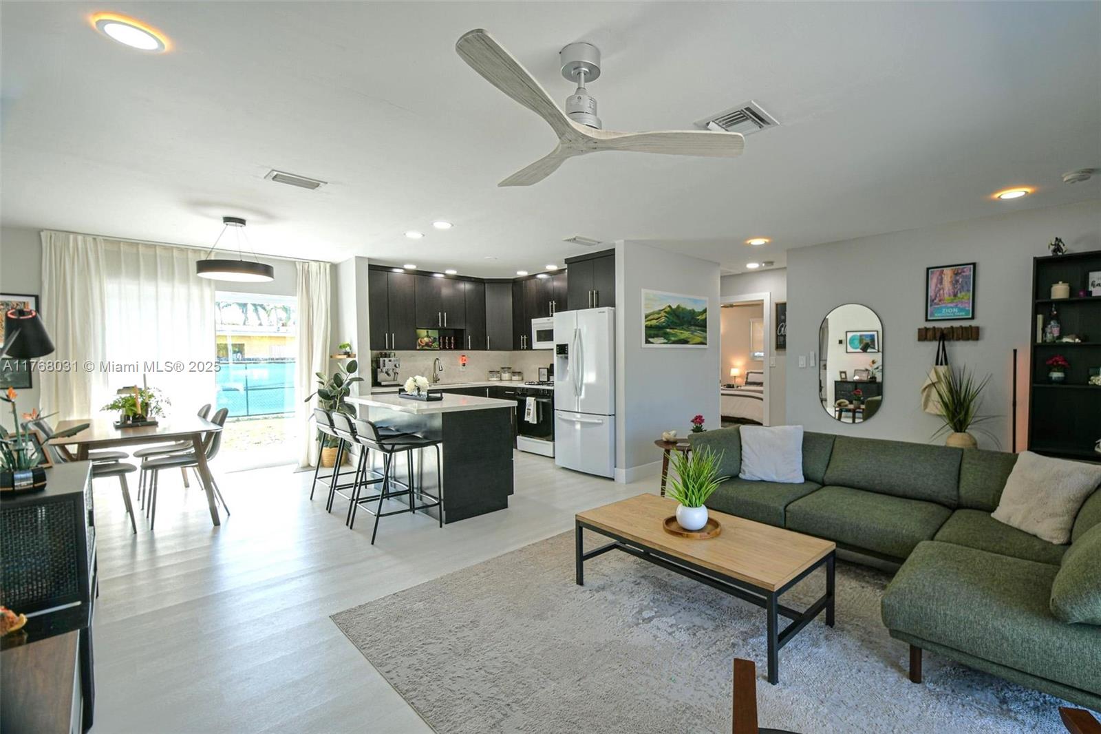 2001 North 31st Road Hollywood, FL 33021 - Photo 13 of 75 a living room with furniture kitchen view and a table