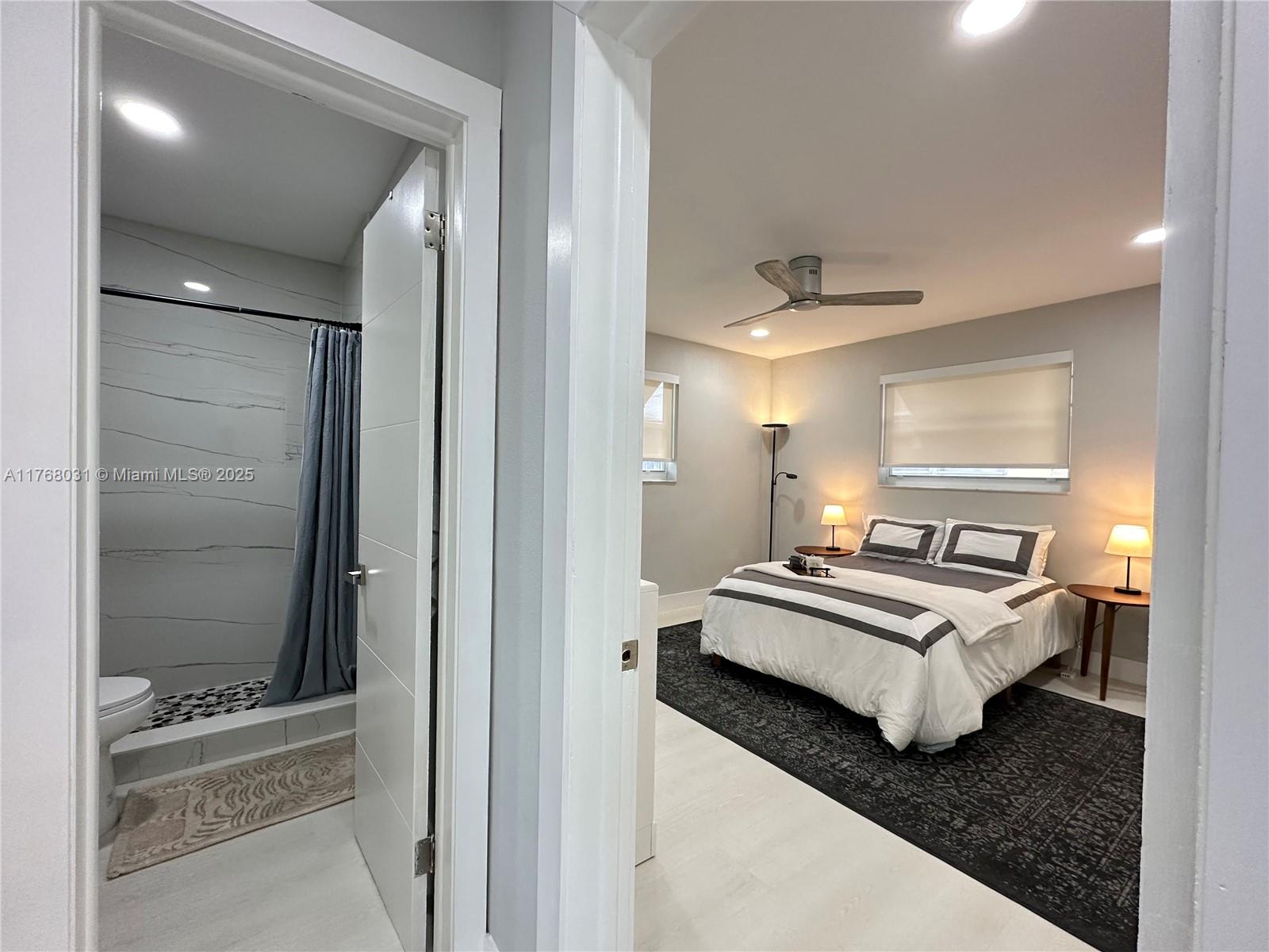 2001 North 31st Road Hollywood, FL 33021 - Photo 15 of 75 a room with a bed and a mirror