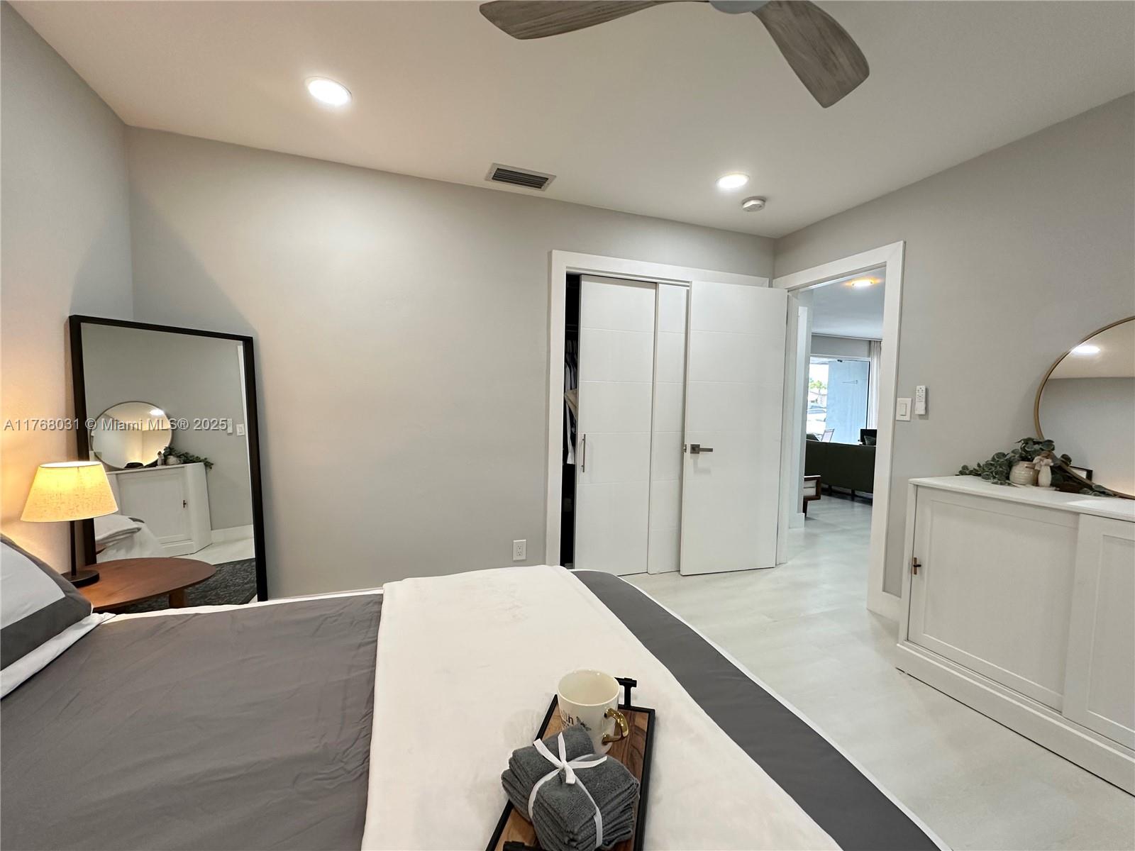 2001 North 31st Road Hollywood, FL 33021 - Photo 19 of 75 a bedroom with a bed and a large mirror