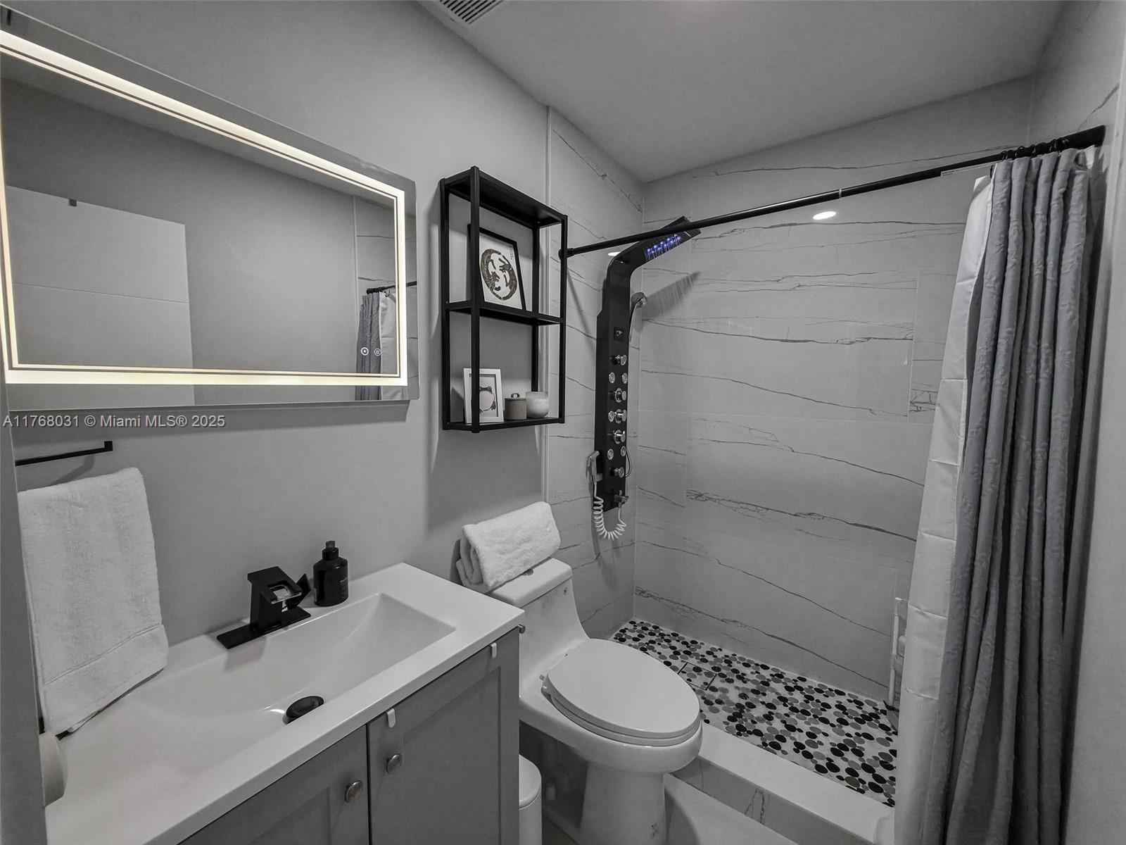 2001 North 31st Road Hollywood, FL 33021 - Photo 22 of 75 a bathroom with a sink toilet and shower